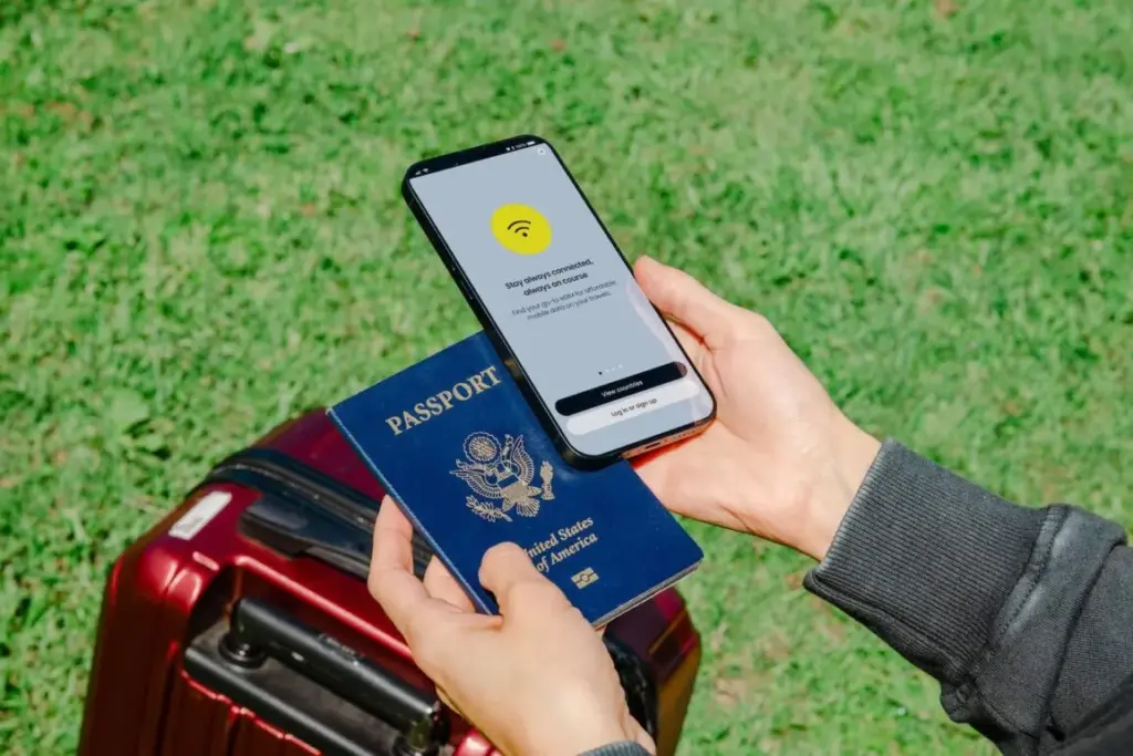 holding a passport mobile phone