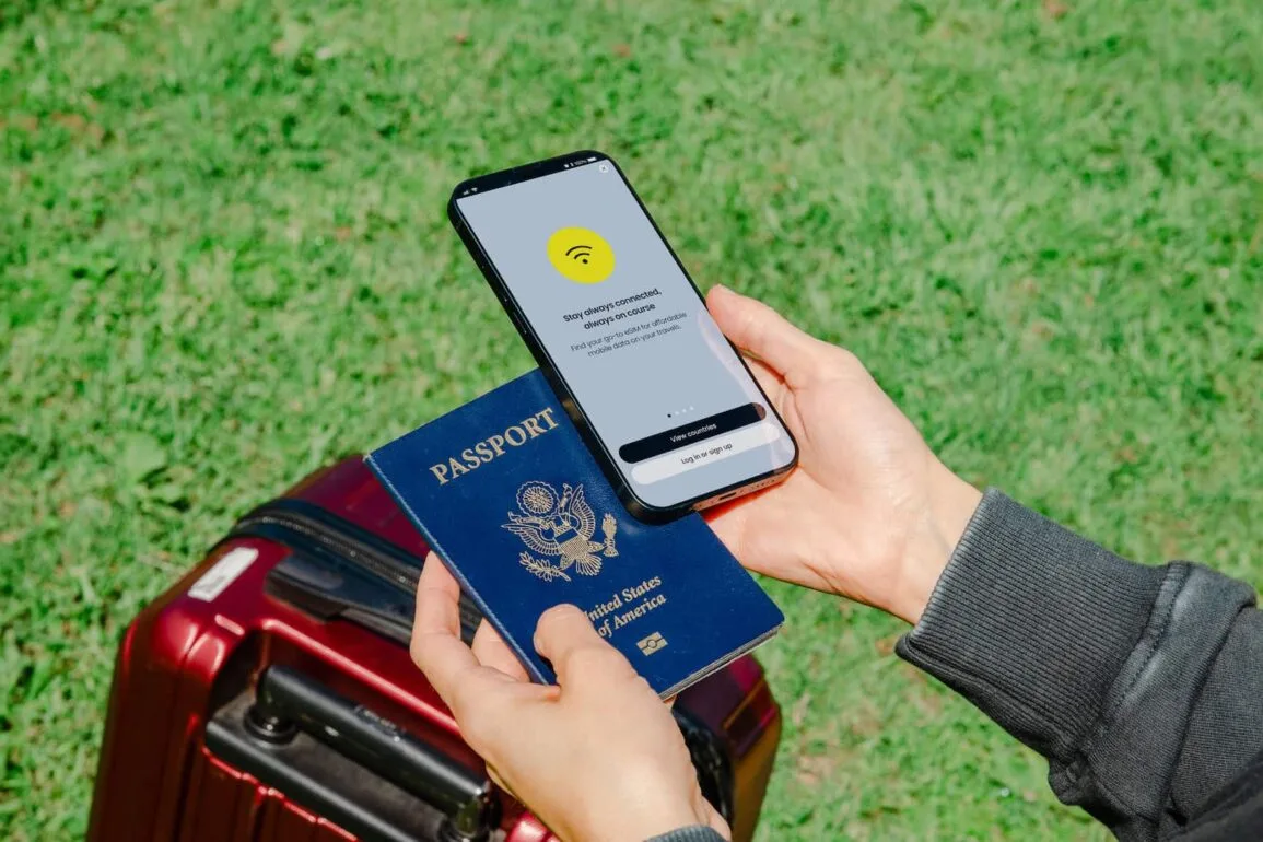 holding a passport mobile phone