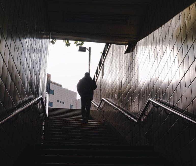 Person exiting a subway station in Seoul, South Korea