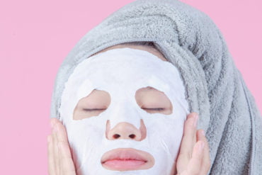 Woman wearing a sheet mask