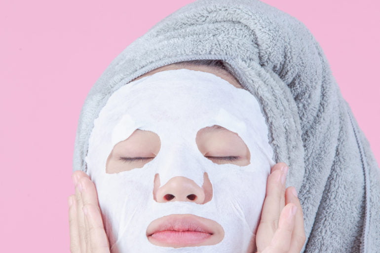 Woman wearing a sheet mask