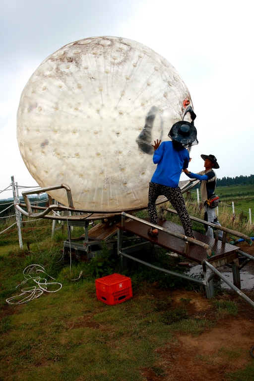 People playing with a big ball
